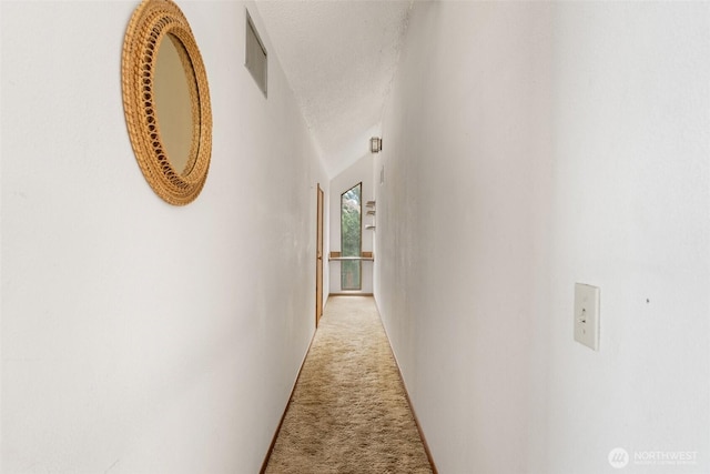 corridor with light carpet and visible vents