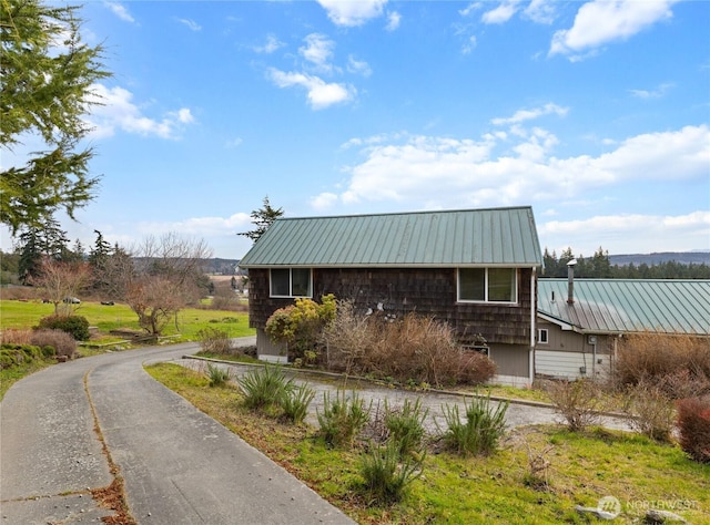 exterior space featuring a standing seam roof and metal roof