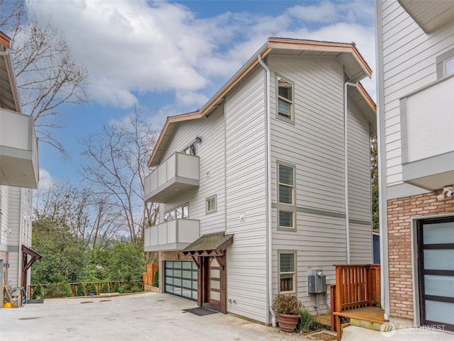 view of side of property featuring driveway