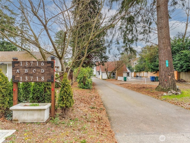 view of street featuring aphalt driveway