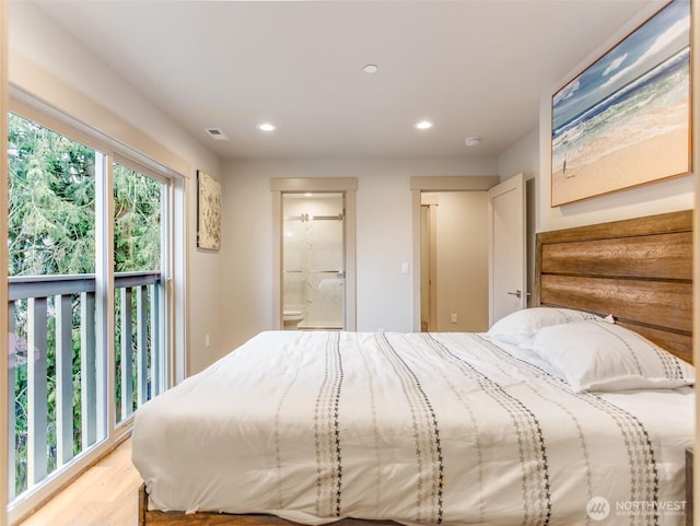 bedroom with wood finished floors, connected bathroom, visible vents, and recessed lighting