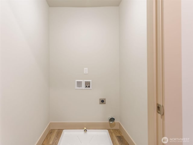 laundry area with hookup for a washing machine, light wood-style flooring, hookup for a gas dryer, laundry area, and electric dryer hookup