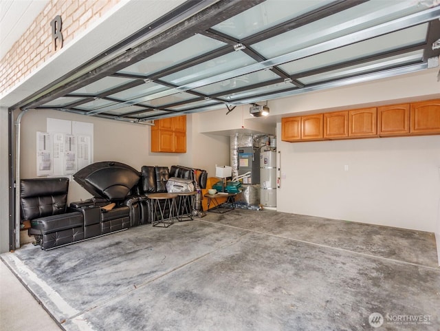 garage with secured water heater and a garage door opener