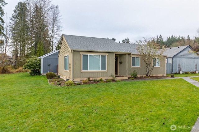 ranch-style home featuring a front yard, crawl space, and roof with shingles