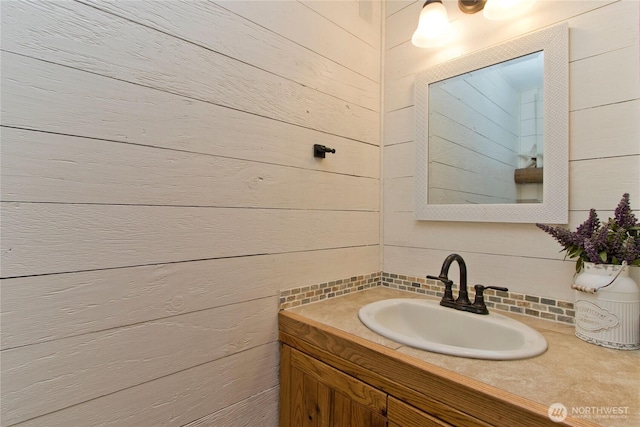 bathroom with vanity and decorative backsplash