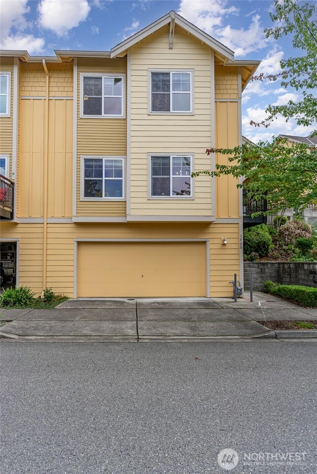 view of front of property with driveway and an attached garage