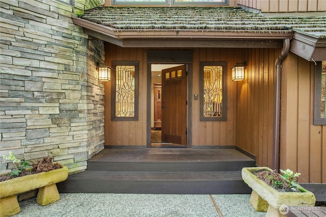 entrance to property with stone siding