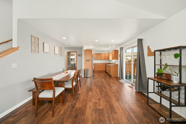 dining space with baseboards, dark wood-style flooring, and recessed lighting