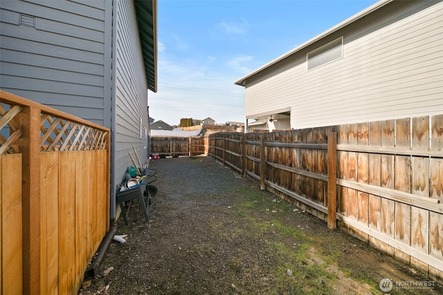 view of yard with a fenced backyard