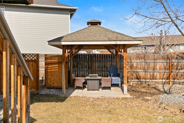 exterior space with fence and a gazebo