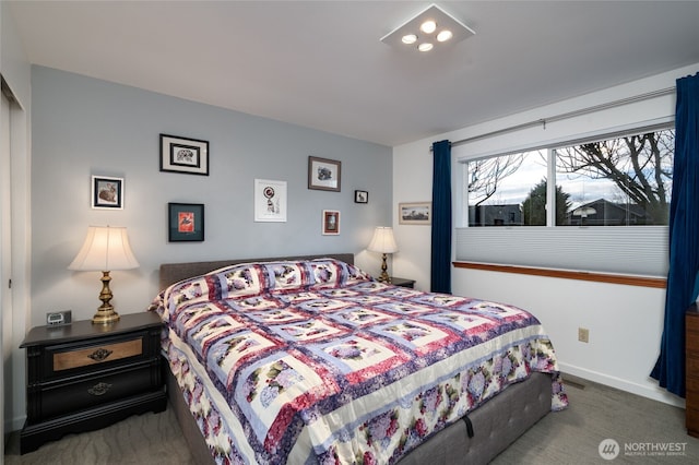 bedroom featuring carpet and baseboards