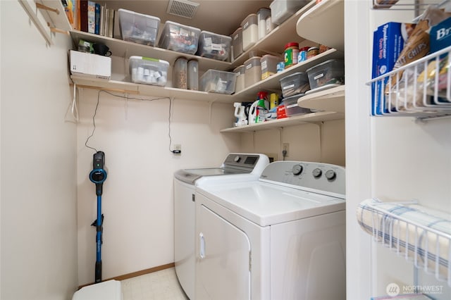 washroom with laundry area, baseboards, independent washer and dryer, and light floors