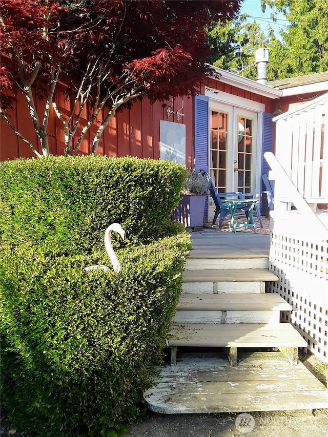 doorway to property with a deck and french doors