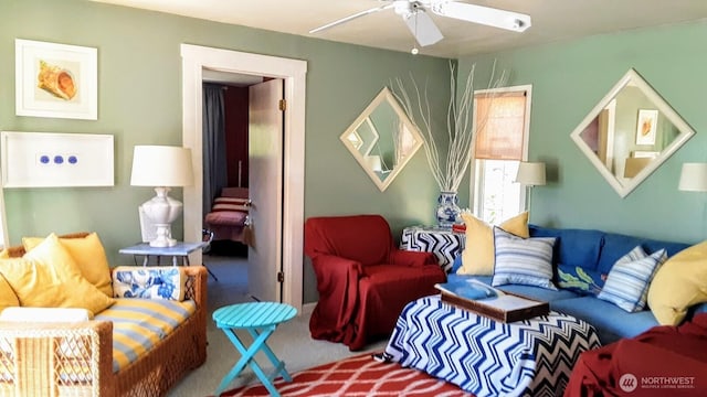 living room with carpet floors and a ceiling fan