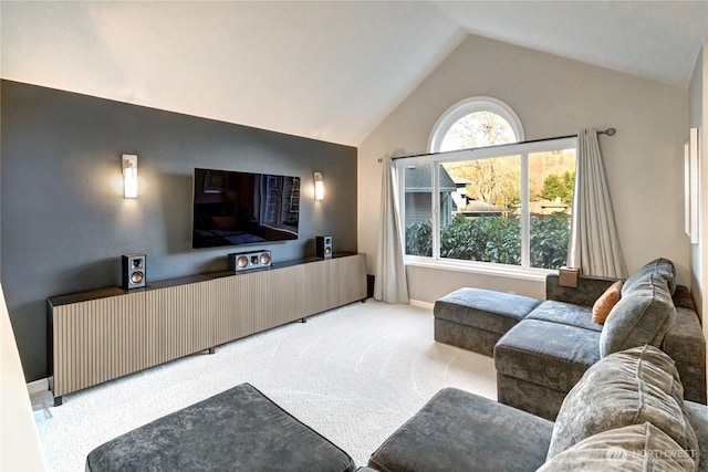 carpeted living room with lofted ceiling