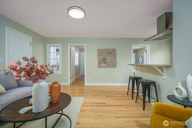 living room with light wood-style floors and baseboards