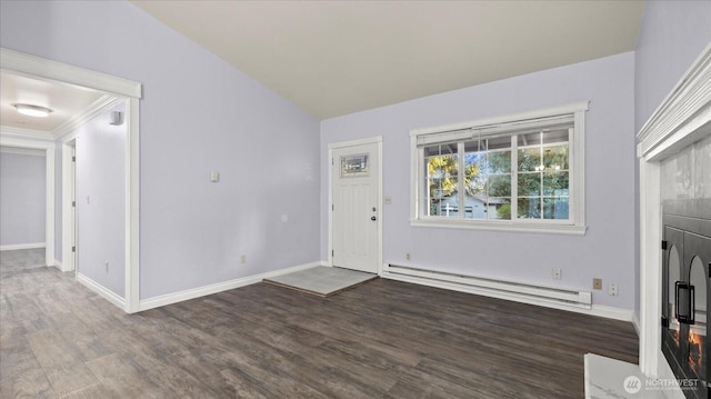 foyer entrance featuring a baseboard radiator, baseboards, and wood finished floors