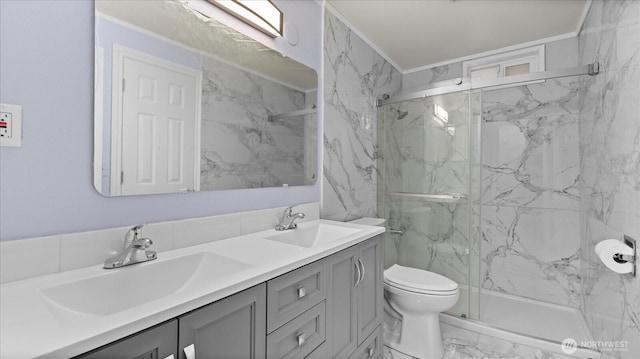 full bathroom featuring marble finish floor, a sink, and a marble finish shower