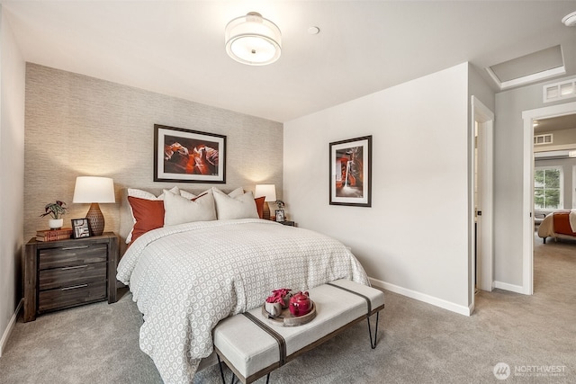 bedroom featuring light carpet, wallpapered walls, attic access, baseboards, and visible vents