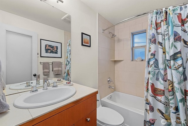 bathroom with toilet, visible vents, shower / bath combo with shower curtain, and vanity