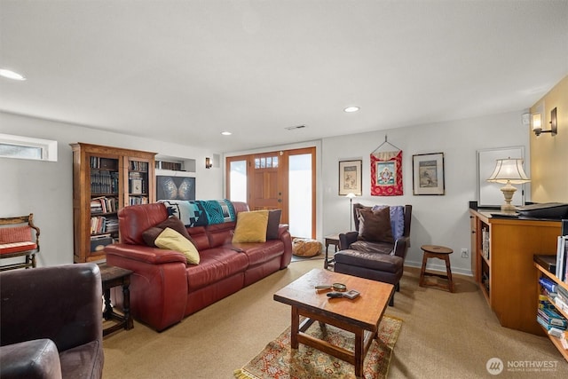 living area with recessed lighting, light carpet, visible vents, and baseboards