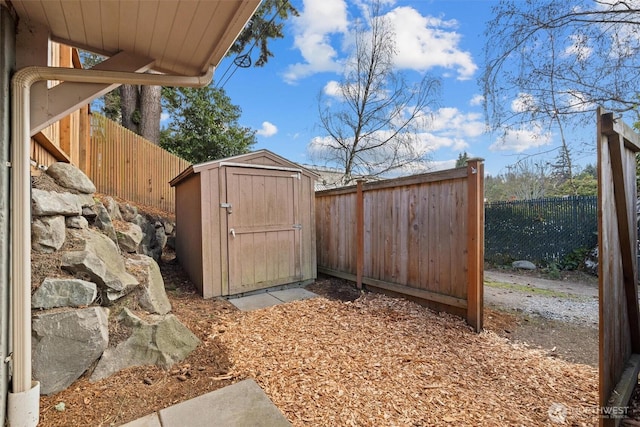 view of shed featuring a fenced backyard