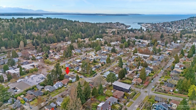 drone / aerial view featuring a water view and a residential view