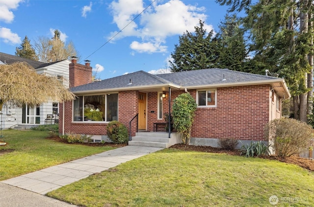 ranch-style house with brick siding, a front lawn, a chimney, and a shingled roof