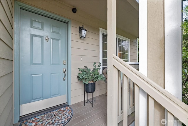 doorway to property featuring a porch