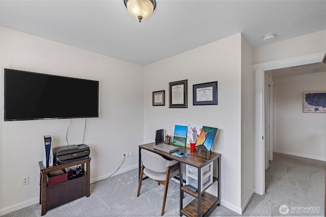 office space featuring carpet and baseboards