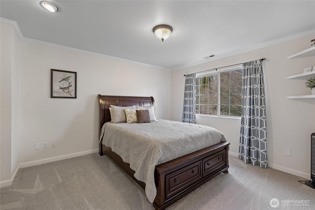 carpeted bedroom featuring ornamental molding, visible vents, and baseboards