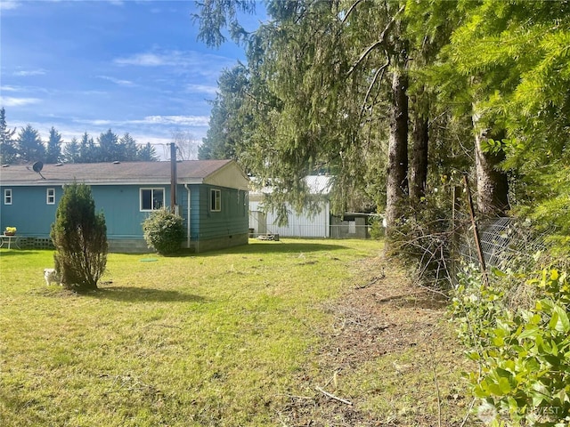 view of yard featuring fence