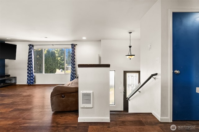 entryway featuring recessed lighting, wood finished floors, baseboards, stairway, and heating unit