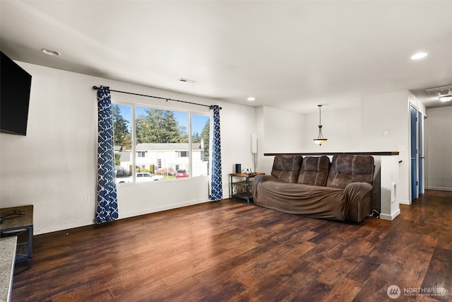 living area featuring recessed lighting, visible vents, baseboards, and wood finished floors