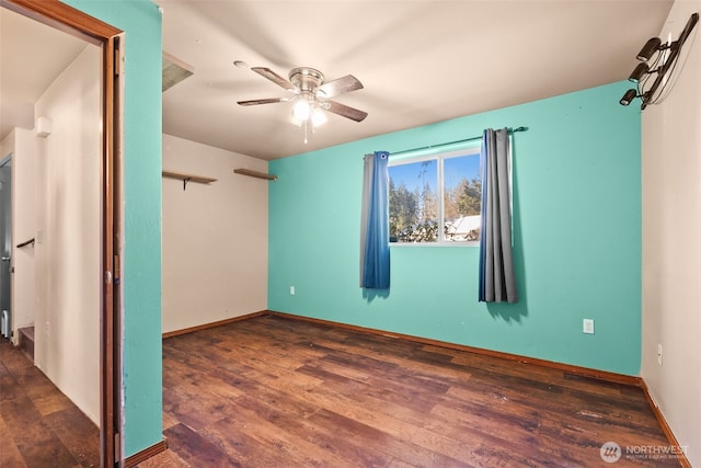 unfurnished bedroom with a ceiling fan, baseboards, and wood finished floors