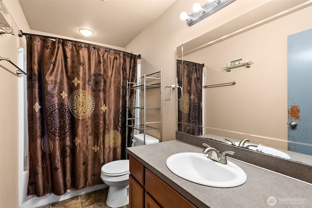 full bathroom with toilet and vanity