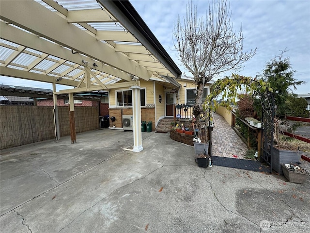 view of patio featuring fence and a pergola