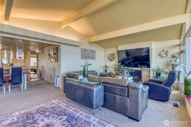 10008 Rainier Ave S, Seattle, WA 98178 - living room with visible vents, a fireplace, vaulted ceiling with beams, and carpet