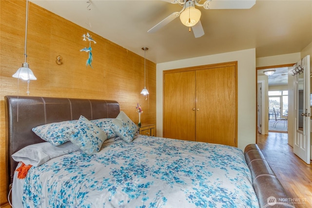10008 Rainier Ave S, Seattle, WA 98178 - bedroom with a closet, wood finished floors, and a ceiling fan