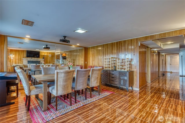 10008 Rainier Ave S, Seattle, WA 98178 - dining room featuring wood walls and a fireplace