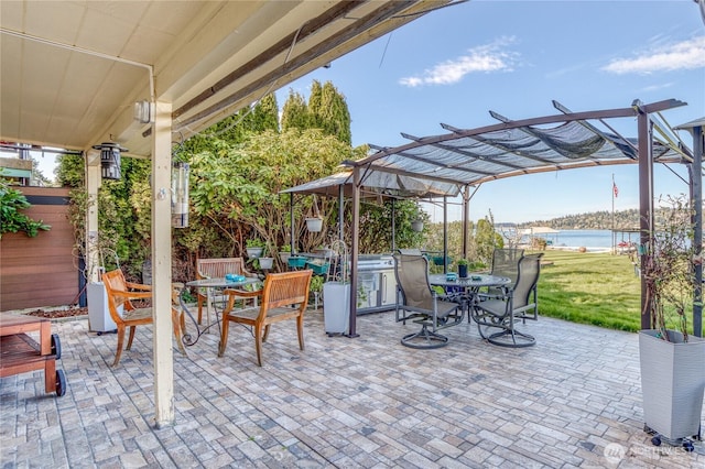 10008 Rainier Ave S, Seattle, WA 98178 - view of patio / terrace featuring a water view, outdoor dining area, and a pergola
