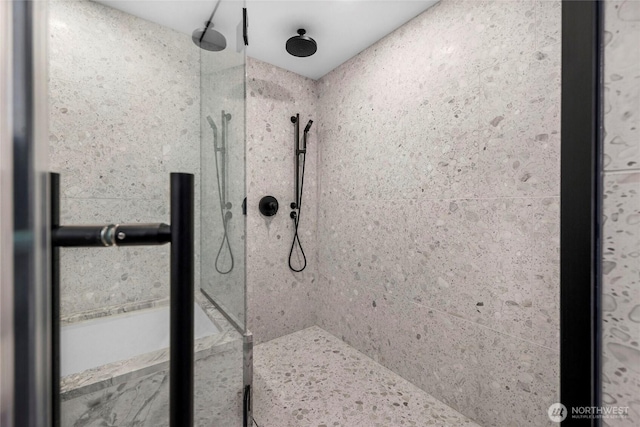 full bathroom featuring tiled shower