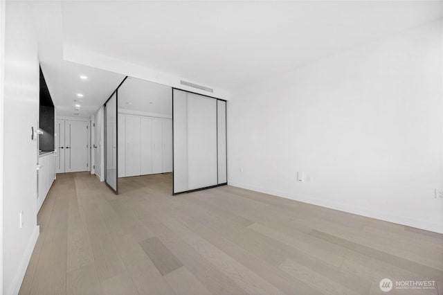 interior space featuring visible vents, recessed lighting, baseboards, and light wood-style floors