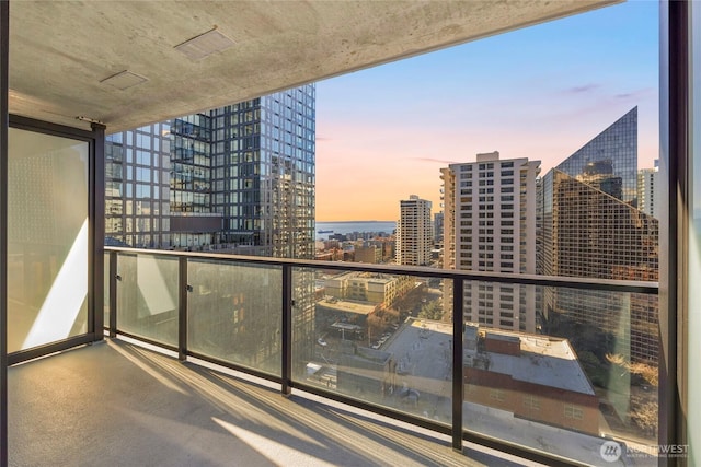 balcony at dusk with a city view