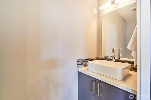 bathroom with visible vents and vanity