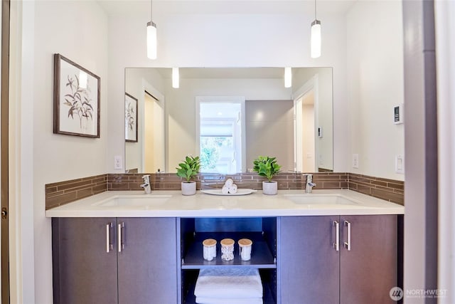 full bath with double vanity and a sink