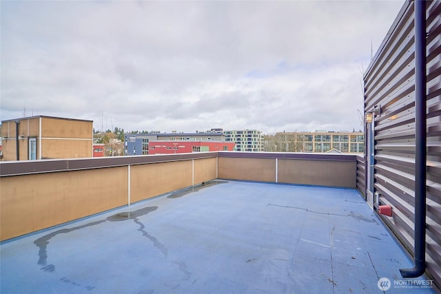 view of patio featuring a view of city and a balcony