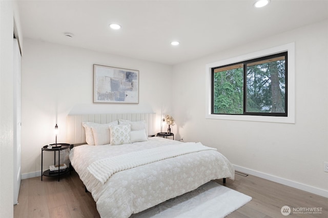 bedroom featuring recessed lighting, baseboards, and wood finished floors