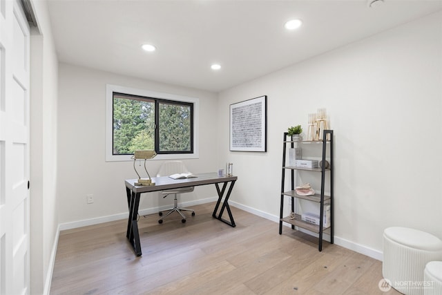 home office featuring baseboards, recessed lighting, and light wood-style floors