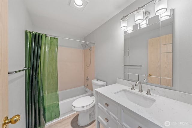 bathroom featuring shower / bath combo, vanity, and toilet